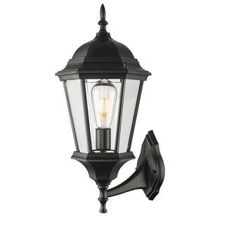 A traditional exterior wall mount featuring durable cast aluminum construction, clear glass panes, and a wet safety rating.